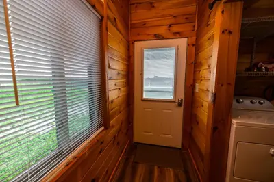 a door in a log cabin with a window at Rustic Mt Sterling Cabin2 Near Downtown Pets OK in Mount Sterling