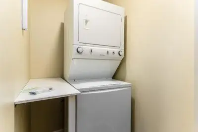 a kitchen with a white stove and a microwave at The Mad Cat Inn in Lewis Center