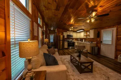 a living room with a couch and a table at Rustic Mt Sterling Cabin1 Near Downtown Pets OK in Mount Sterling