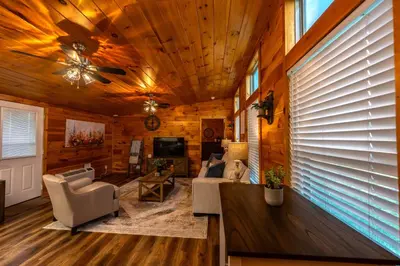 a living room with wooden walls and a ceiling at Rustic Mt Sterling Cabin1 Near Downtown Pets OK in Mount Sterling