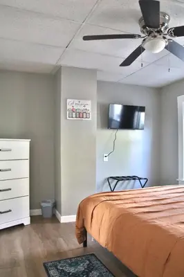 a bedroom with a bed and a ceiling fan at Updated Lakewood Retreat! in Lakewood