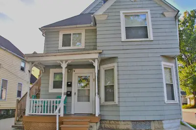 a house with a white door and a porch at Updated Lakewood Retreat! in Lakewood