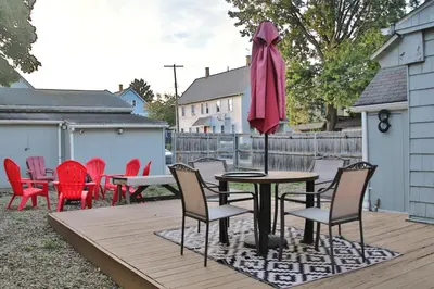 a table and chairs and an umbrella on a deck at Updated Lakewood Retreat! in Lakewood
