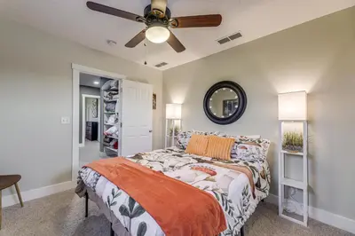 a bedroom with a bed and a ceiling fan at Private Ponds and Trails Hillsboro Nature Retreat! in Hillsboro