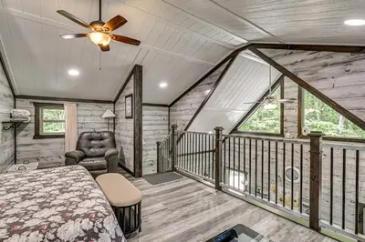 a bedroom with a bed and a ceiling fan at Ohio Amish Country Getaway Fish, Hike, Boat! in Sugarcreek