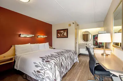 a hotel room with a bed and a desk at Red Roof Inn St Clairsville - Wheeling West in Saint Clairsville
