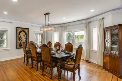 a dining room with a table and chairs at Modern Group Getaway with Private Yard in Cincinnati in Cincinnati