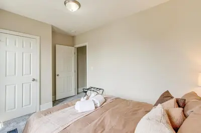 a bedroom with a bed and a closet at 6 Mi to Ohio State Walkable Home in S Columbus! in Columbus