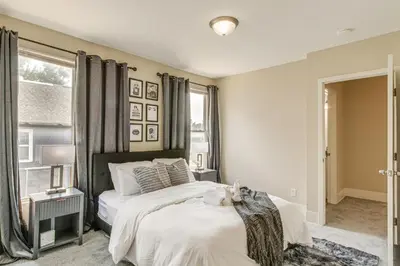 a bedroom with two beds and a window at 6 Mi to Ohio State Walkable Home in S Columbus! in Columbus