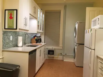 a kitchen with a sink and a refrigerator at Center of Action PARK ONSITE Gated on 2nd Fl in Cincinnati