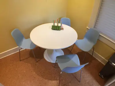 a white table and chairs in a room at Center of Action PARK ONSITE Gated on 2nd Fl in Cincinnati