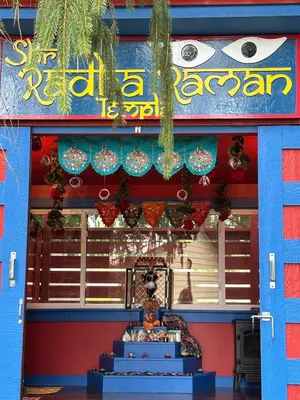 a store front with a blue and red building at Buddhas Little Cabin! 1 min from Palace of Gold in Moundsville