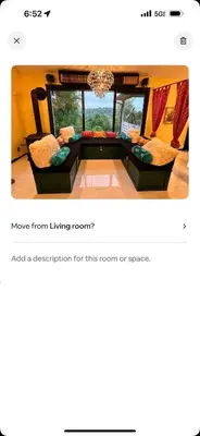 a screenshot of a living room with two chairs and a couch at Buddhas Little Cabin! 1 min from Palace of Gold in Moundsville