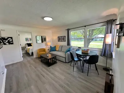 a living room with a couch and a table at KING bed, Pet Friendly, Modern Retreat in CLE-BW in Berea