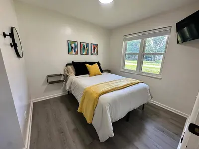 a bedroom with a bed and a window at KING bed, Pet Friendly, Modern Retreat in CLE-BW in Berea