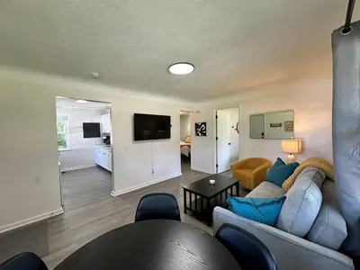 a living room with a couch and a table at KING bed, Pet Friendly, Modern Retreat in CLE-BW in Berea