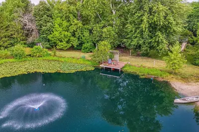 an aerial view of a lake with two boats in it at Fish, Hike and Golf Countryside Retreat in Bluffton in Bluffton