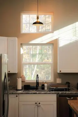 a kitchen with a sink and a window at The Treetop Retreat – Family Getaway in Scenic Hocking Hills in Logan