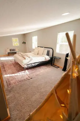 a bedroom with a large bed in a room at The Treetop Retreat – Family Getaway in Scenic Hocking Hills in Logan