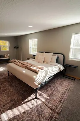 a bedroom with a large bed in a room at The Treetop Retreat – Family Getaway in Scenic Hocking Hills in Logan