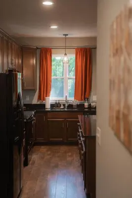 a kitchen with a sink and a window at Modern 2 BD cabin with hot tub & Games & Central Loc in Rockbridge