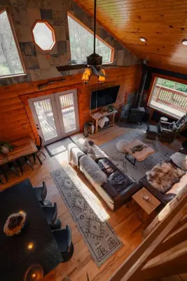 an overhead view of a living room in a log cabin at COZY Cabin with Hot Tub - Near all in Hocking Hills in Logan