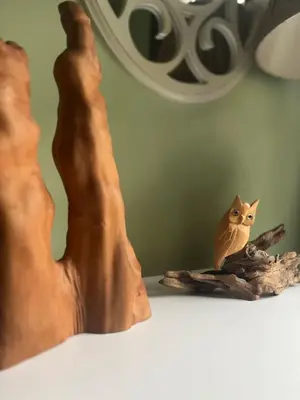 a figurine of an owl sitting on a table at Blue Heron Cottage with Game Room, Deck & Hot Tub in Logan