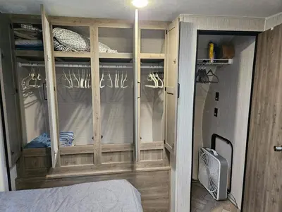 a room with a bedroom with a window and a tv at Tranquil Stay Close to Hotspots