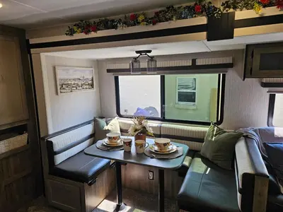 a small room with a table and two cups on it at Tranquil Stay Close to Hotspots