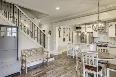a kitchen and dining room with a table and chairs at Modern Comfort Near Columbus Home with Yard and Porch in London