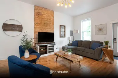 a living room with a couch and a tv at 2BR Townhome - Free Parking, Minutes to Stadiums in Covington