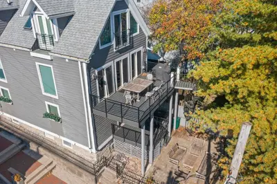 an aerial view of a house with a balcony at 1BR, Next to Monastery Wedding Venue, with Bathtub in Cincinnati