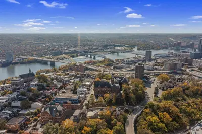 an aerial view of a city with a river at 1BR, Next to Monastery Wedding Venue, with Bathtub in Cincinnati