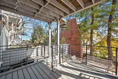 an empty balcony of a house with trees in the background at Next to Monastery Wedding Venue, 2BR with Balcony in Cincinnati