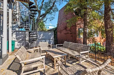 a group of benches and tables on a sidewalk at Next to Monastery Wedding Venue, 2BR with Balcony in Cincinnati