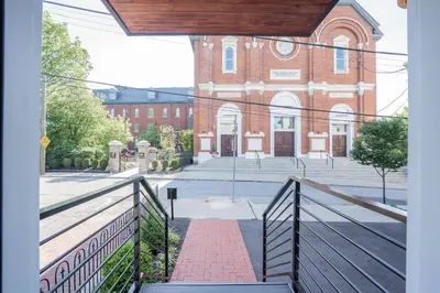 a view of a brick building from a balcony at Next to Monastery Wedding Venue, 2BR with Balcony in Cincinnati