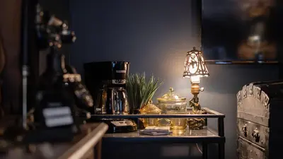 a table with a lamp on top of it at Pickle Factory Hotel - 2BR Next to Wenzel Distillery in Covington