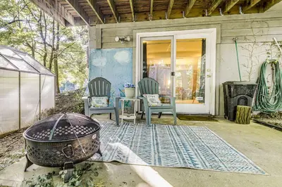 a house with two chairs and a grill on a porch at 10 Mi to Dtwn Cozy Couples Getaway in Cincinnati in Cincinnati