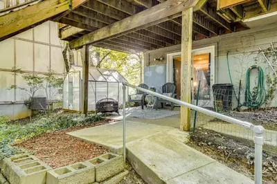 an abandoned house with a glass door and a porch at 10 Mi to Dtwn Cozy Couples Getaway in Cincinnati in Cincinnati