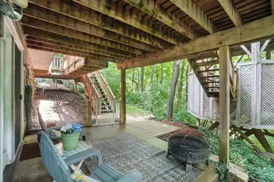 a screened in porch of a house with a grill at 10 Mi to Dtwn Cozy Couples Getaway in Cincinnati in Cincinnati