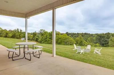 a patio with a table and chairs on a lawn at 14 Mi to Ark Encounter Rural Corinth Escape! in Corinth