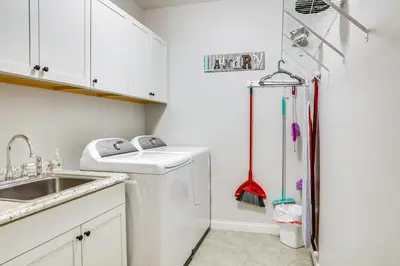 a kitchen with a sink and a refrigerator at 14 Mi to Ark Encounter Rural Corinth Escape! in Corinth