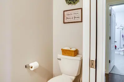 a bathroom with a toilet with a basket on top at 14 Mi to Ark Encounter Rural Corinth Escape! in Corinth