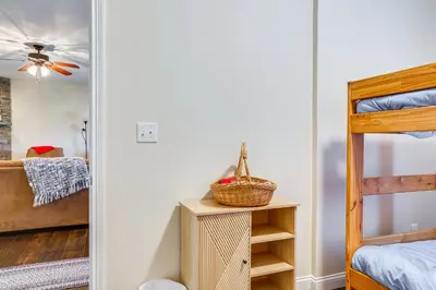 a bedroom with a bed and a bunk bed at 14 Mi to Ark Encounter Rural Corinth Escape! in Corinth