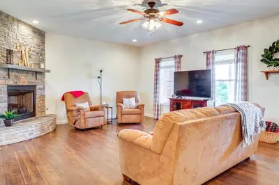 a living room with a couch and chairs and a fireplace at 14 Mi to Ark Encounter Rural Corinth Escape! in Corinth