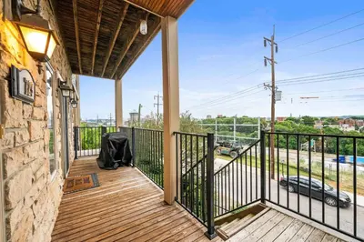 a balcony of a house with a view of a street at Hilltop 3BR for 10, Private Garage, Skyline Views in Covington