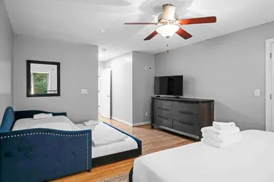 a bedroom with two beds and a ceiling fan at Hilltop 3BR for 10, Private Garage, Skyline Views in Covington