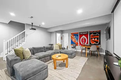 a living room with a couch and a table at Hilltop 3BR for 10, Private Garage, Skyline Views in Covington