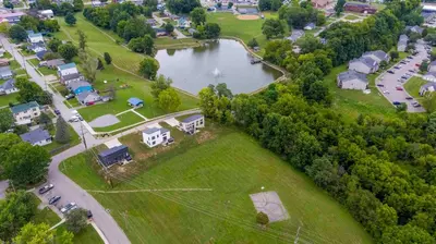 an aerial view of a park with a lake and houses at Hot Tub, 3BR for 10, Near Ark, Private Parking in Dry Ridge