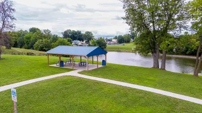 a gazebo in a park next to a river at Hot Tub, 3BR for 10, Near Ark, Private Parking in Dry Ridge